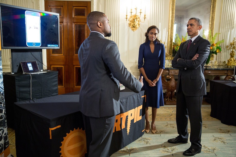 President Barack Obama hosts White House Demo Day, which celebrates the role entrepreneurship plays in America's economy, in the State Dining Room of the White House, Aug. 4, 2015. The President discusses the Partpic replacement part exhibit with Jewel Burks and Jason Crain from Atlanta, Ga. (Official White House Photo by Pete Souza)