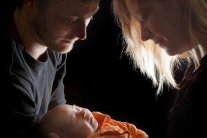 6116435 - loving couple holding their newborn little baby