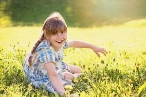 person-human-child-girl-blond-laugh-meadow-grass