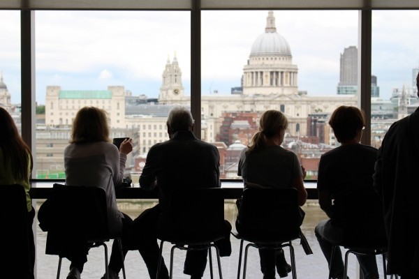 people-in-cafe-looking-at-city