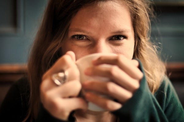 portrait-of-smiling-woman-drinking-coffee