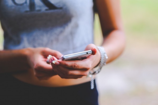 woman-holding-mobile-phone