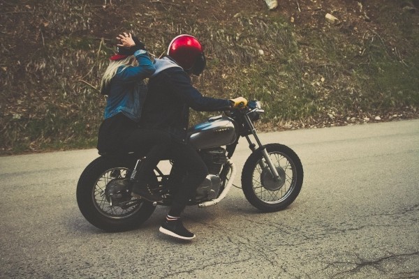 couple-riding-motorcycle-on-street