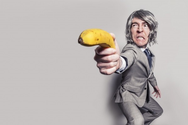 businessman-aiming-with-banana