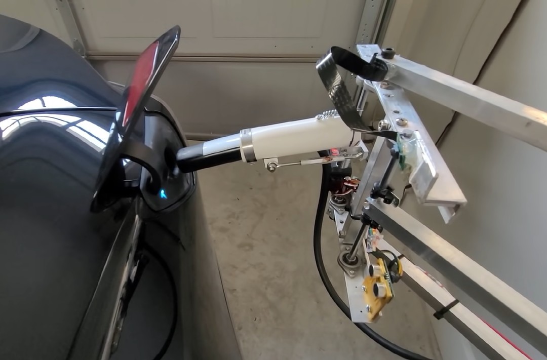 robot arm charge Tesla