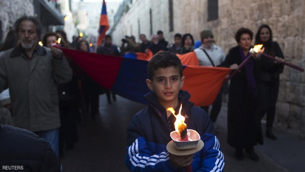Members of the Armenian community attend a memorial march marking the 100th anniversary of the mass killings of 1.5 million Armenians by Ottoman Turkish forces in Jerusalem's Old City April 23, 2015. Armenia say the massacres during World War One constitute genocide -- a term used this month by Pope Francis. Muslim Turkey accepts many Christian Armenians were killed in partisan fighting during the war, but denies it amounted to genocide. REUTERS/Ronen Zvulun